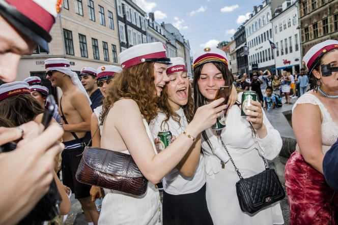 Danish high school students celebrate their graduation in Copenhagen in June 2019.