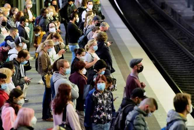 Passengers wait for their train in Hamburg (northern Germany), August 11, 2021.