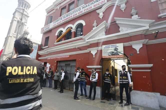 Police outside the Peru Libre party headquarters in Lima, Peru, Saturday July 28.