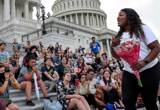 House Congresswoman Cori Bush addresses protesters who have come to her support as she camps outside Congress in Washington in August 2021.