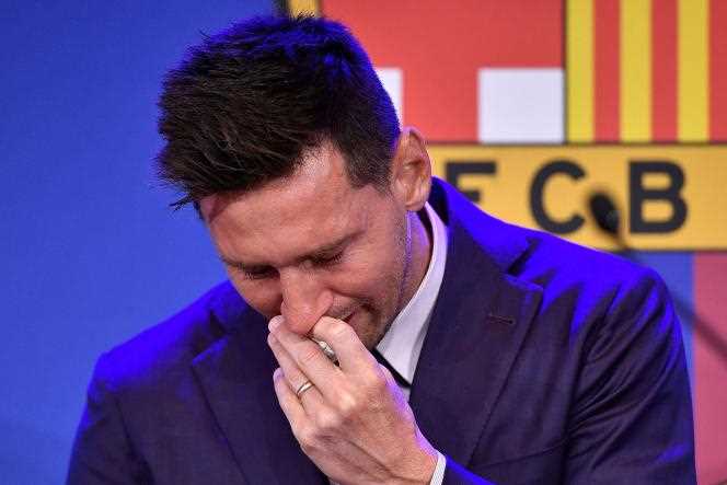 FC Barcelona's Argentine striker Lionel Messi cries during a press conference at Barcelona's Camp Nou stadium on August 8, 2021.