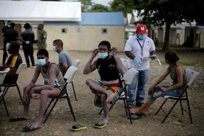 Migrants wait for medical treatment at a center in Meteti, Panama, Friday August 6.
