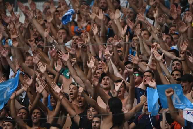 Fans of Olympique de Marseille cheer on their team during a friendly match against Villarreal, at the Orange Vélodrome in Marseille, Saturday July 31, 2021.