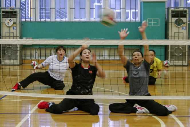 Tang Xuemei (top left) lost his leg in the May 2008 earthquake in Sichuan, which left over 80,000 people dead and missing.  She has since won the gold medal in sitting volleyball at the 2012 Olympics and will be in Tokyo.
