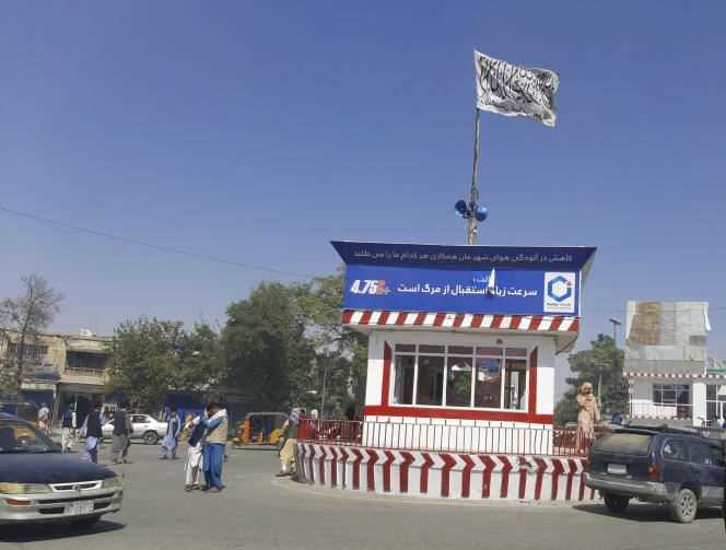 A Taliban flag flies over the main square in the Afghan town of Kunduz on August 8.