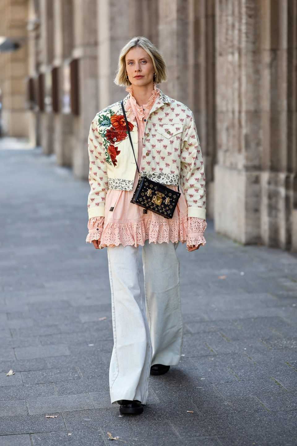 Floral jacket: woman wears a short jacket with a floral pattern