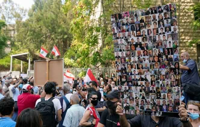 Photos of the victims of the Beirut port explosion in 2020, during the protest outside the courthouse after an investigation into the explosion was frozen on September 29, 2021.