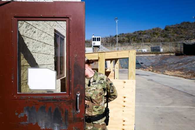 US base at Guantanamo, 2017. A female guard hides her face during a visit organized for the media.