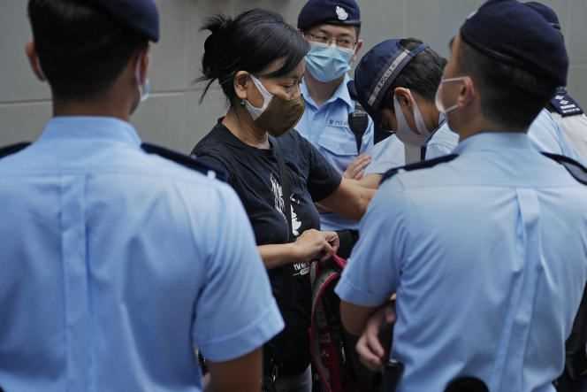 Activist Chen Baoying arrested by police during protests against the election of the committee called to elect the next Hong Kong leader, in Hong Kong on September 19, 2021.