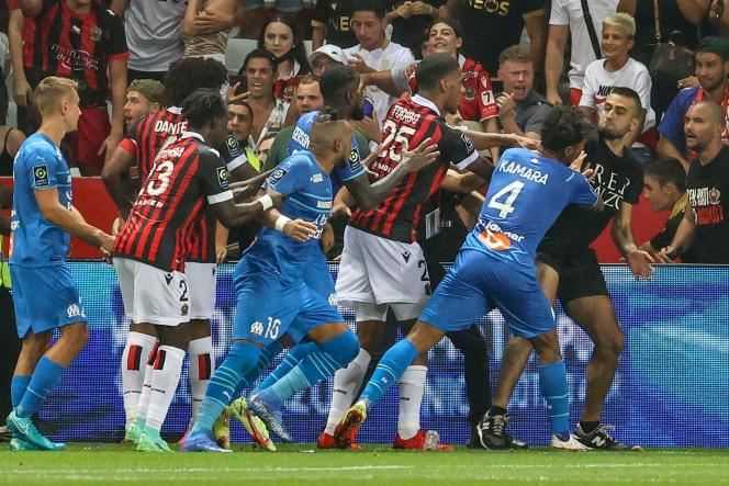 Players from Marseille and Nice teams, staff members and supporters took part in a general scuffle after Dimitri Payet received a bottle on his back in Nice on August 22, 2021.