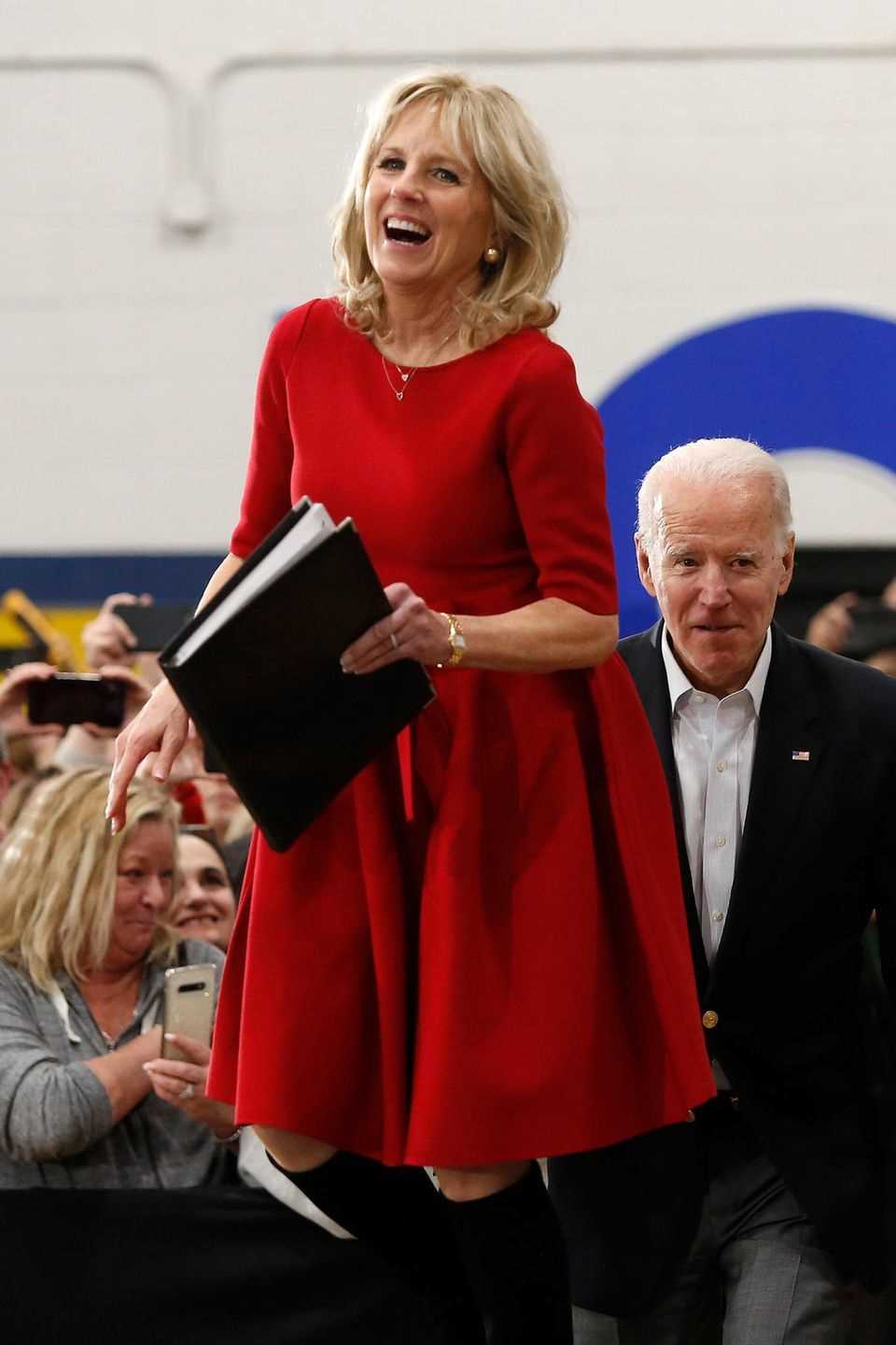 The red bell-skirt dress that Jill Biden wears to a campaign rally in Des Moines not only puts her in a good mood.