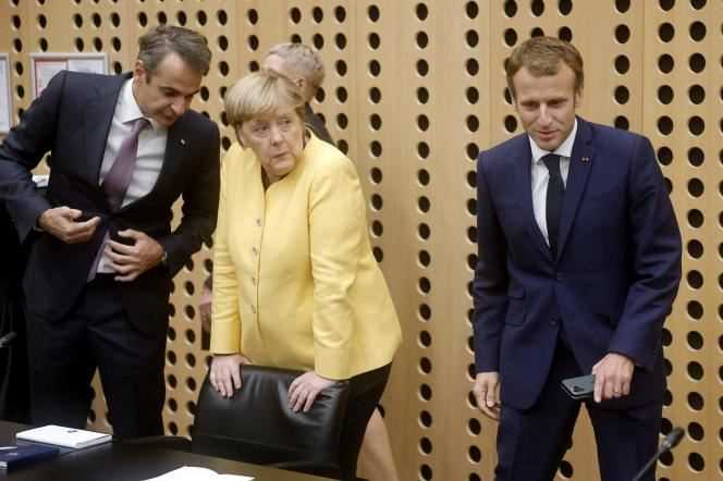 Greek Prime Minister Kyriakos Mitsotakis (left), German Chancellor Angela Merkel (center), and French President Emmanuel Macron (right), upon their arrival at the EU-Western Balkans summit at the Brdo Congress Center, near Ljubljana (Slovenia), October 6, 2021.