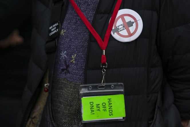 A woman wears an anti-vaccine badge in New York City on October 12, 2021.