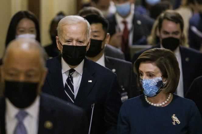 Joe Biden walks into the Capitol Building with House Speaker Nancy Pelosi for a meeting with Democrats on the Build Back Better plan on October 27, 2021, in Washington, DC.