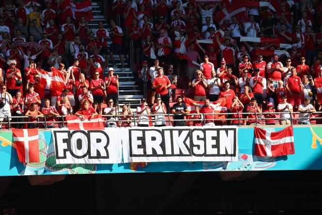 Danish supporters display a banner in support of player Christian Eriksen at Parken Stadium in Copenhagen on June 17, 2021.