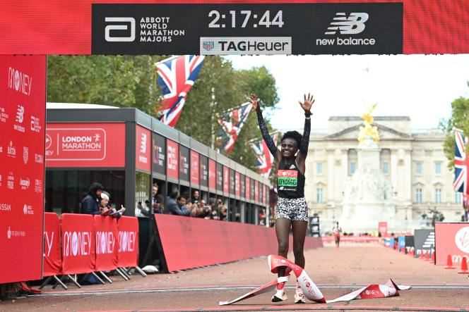 Kenya's Joyciline Jepkosgei crosses the finish line of the London Marathon, UK on Sunday October 3, 2021.
