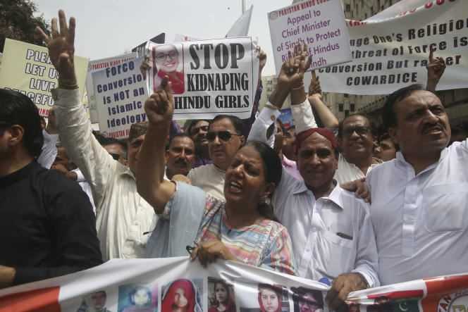 Pakistani Hindu Council activists and members of civil society protest the forced conversions of Hindu girls to Islam and their forced marriages, in Karachi, Pakistan, Friday, July 5, 2019.