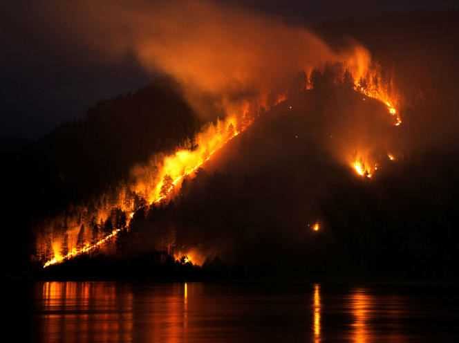Forest fire by the Yenisei River near the Siberian city of Krasnoyarsk on April 21, 2011.