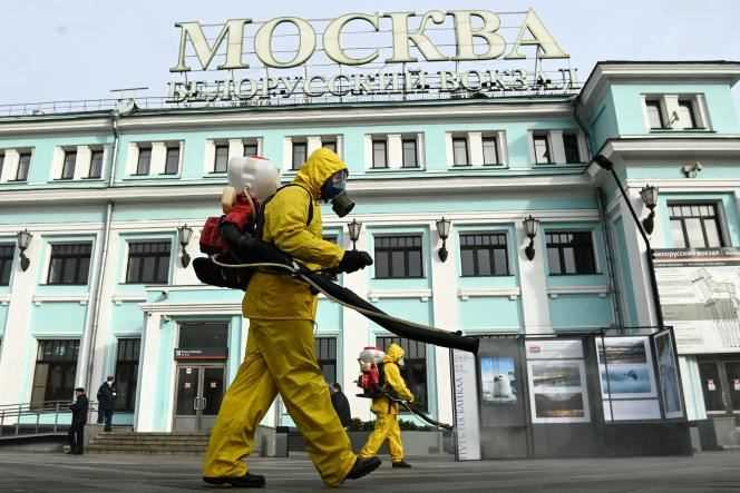 Agents of the Russian Emergency Situations Ministry wearing protective gear disinfect Belorussky station in Moscow on October 20, 2021, amid the coronavirus pandemic.