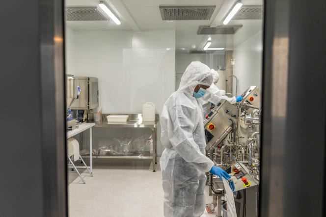 Technicians wearing protective suits operate machines in Afrigen's laboratory in Cape Town, South Africa on Monday, July 12, 2021.