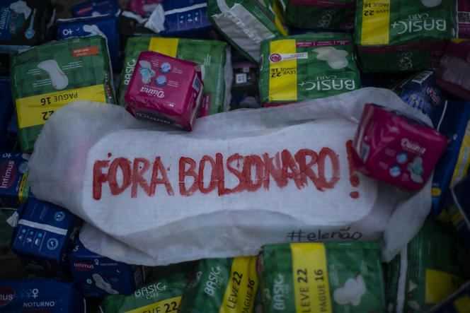 A message calling for the president's departure is written on a sanitary napkin during a demonstration in Rio de Janeiro on October 13, 2021.
