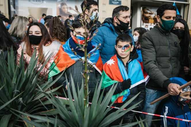 In Baku, on December 10, 2020, demonstrators dressed in the colors of the national flag, attend the military parade after the recapture of the Armenian territories of Nagorno-Karabakh by Azerbaijani troops.
