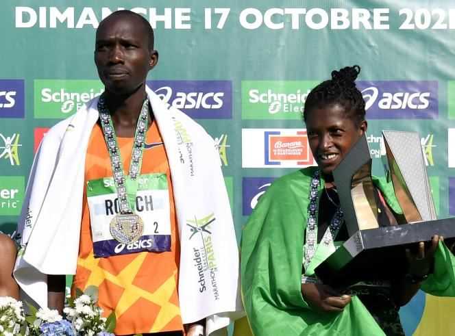 The winners of the Paris marathon: the Kenyan Elisha Rotich and the Ethiopian Tigist Memuye.