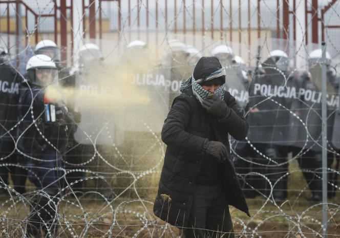 A Polish serviceman sprays tear gas near Grodno, Belarus on November 16, 2021.
