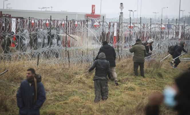 Polish soldiers fire tear gas near Grodno, Belarus on November 16, 2021.