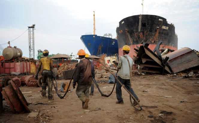 At the Alang deconstruction yard in India, workers who reverse engineer ships work in often inhuman conditions.  Here, in 2011.