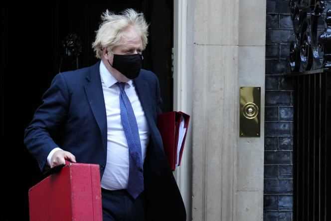 Boris Johnson leaves 10 Downing Street to attend the weekly Prime Minister's Questions session in the London House of Commons on November 17, 2021.