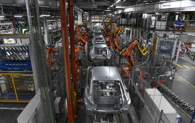 Robots work on an assembly line of the car manufacturer BMW, in Munich (southern Germany), October 22, 2021.