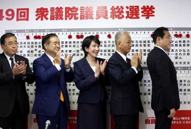 Japanese Prime Minister and Leader of the Liberal Democratic Party, Fumio Kishida, with senior party members.  The board lists the names of the successful candidates for the general election at party headquarters in Tokyo on October 31, 2021.