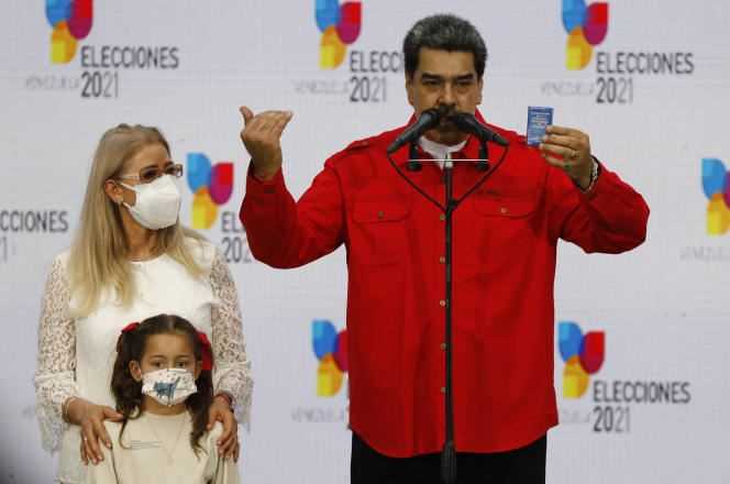 Venezuelan President Nicolas Maduro, accompanied by his wife Cilia Flores and his granddaughter, in Caracas, November 21, 2021.