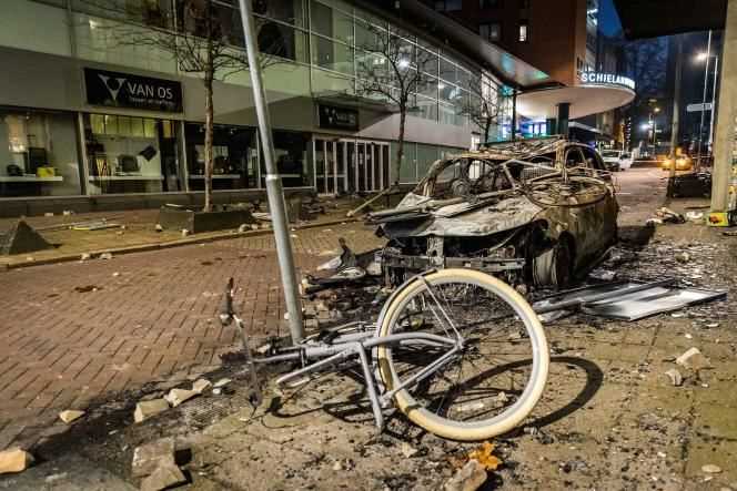 A car set on fire after a demonstration against anti-Covid restrictions, in Rotterdam, on November 20, 2021.