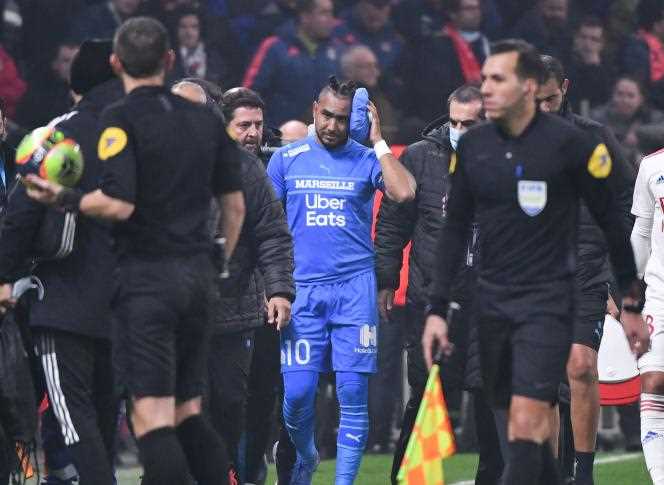 Dimitri Payet shortly after being hit by a bottle of water thrown from the stands, at Groupama Stadium in Lyon, on November 21, 2021.