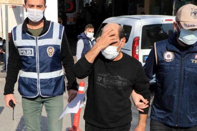 Syrian singer Omar Souleyman leaves hospital escorted by Turkish police in Sanliurfa on November 18, 2021.