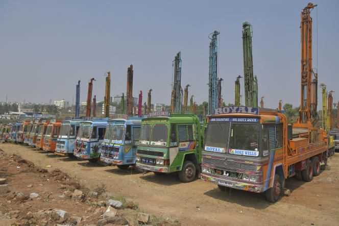Trucks equipped with drilling rigs, in Bangalore (southern India), February 16, 2021.