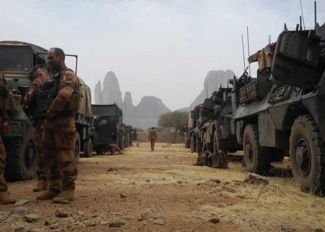 French soldiers stand near a convoy of armored vehicles on March 27, 2019, during the start of the French force's operation “Barkhane” in the Gourma region of Mali.