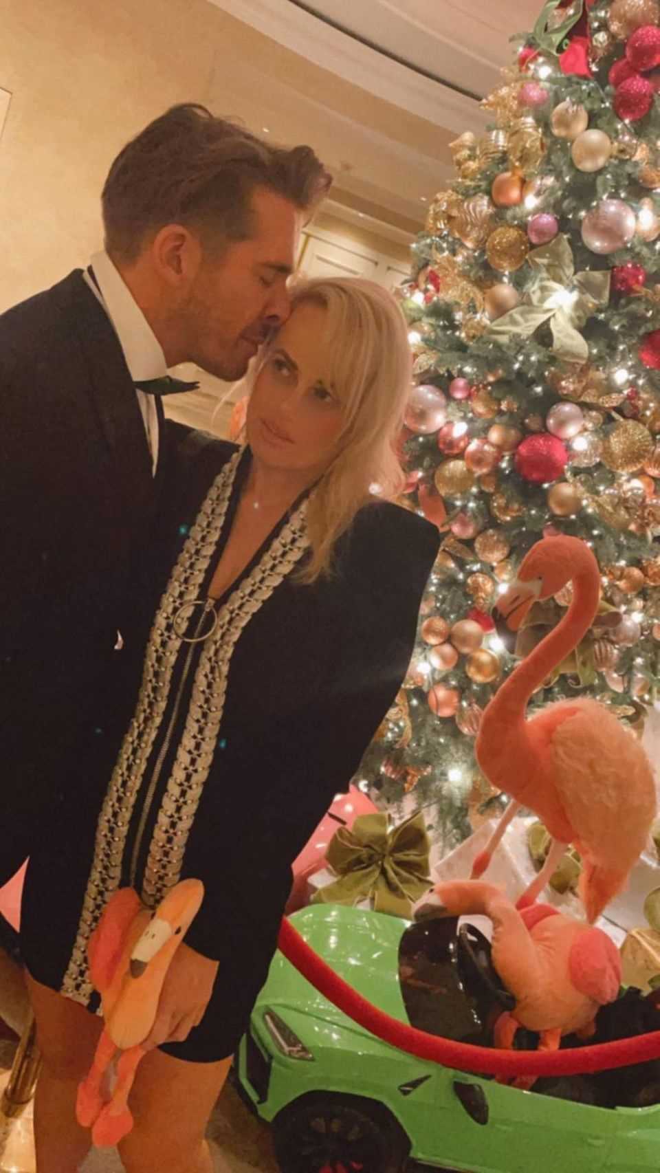 You kiss good friends: Rebel Wilson shares footage of a Christmas party with Hugh Sheridan.