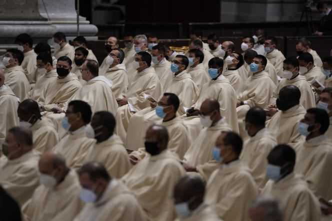 Priests await Mass pronounced by Pope Francis on December 24, 2021 at the Vatican.