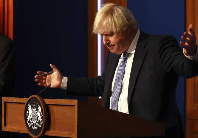 Boris Johnson at a press conference in Downing Street in London on December 8, 2021, following a meeting of ministers considering further restrictions in response to the spread of the virus.