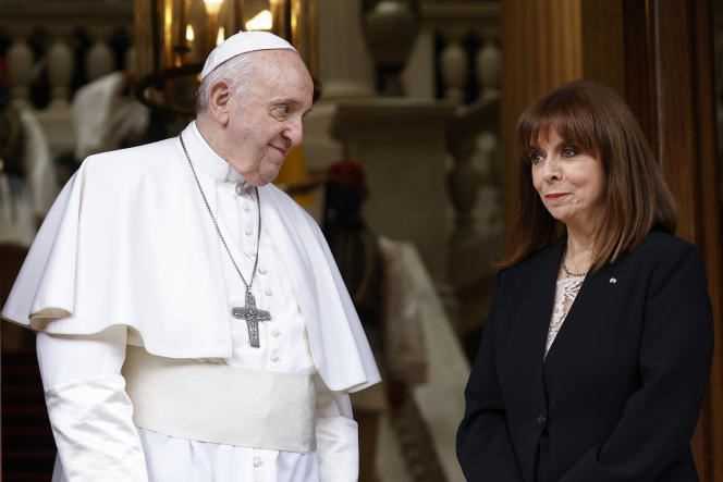 Pope Francis is greeted by Greek President Katerina Sakellaropoulou upon her arrival at the Presidential Palace in Athens on Saturday, December 4, 2021.