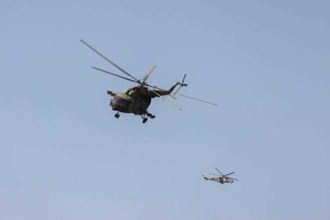 Helicopters fly over Pemba during the Mozambican Armed Forces Day, September 25, 2021.