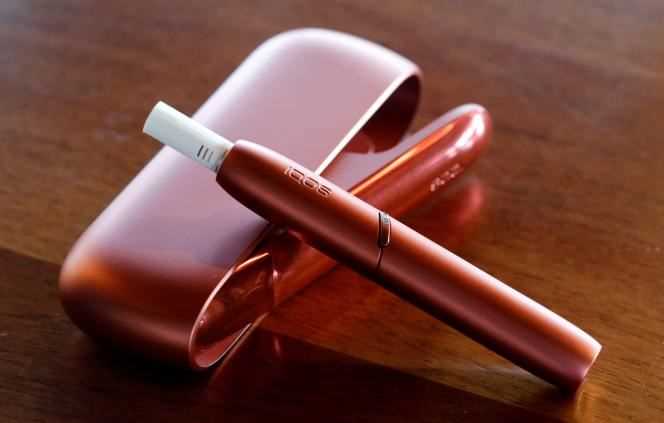 The charger and holder for the IQOS electric tobacco heating system from Swiss cigarette manufacturer Philip Morris are on display after a press conference in Bern, November 19, 2019.