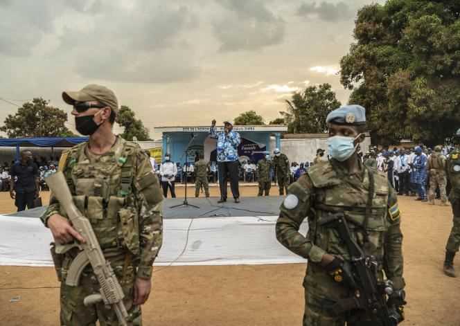 A Russian member of the Wagner group (left) and a United Nations forces soldier during an election rally for President of the Central African Republic Faustin-Archange Touadera, in Bangui, December 12, 2020.