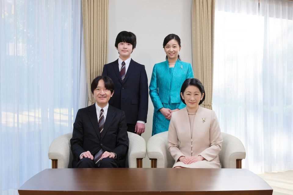 Japan's Crown Prince Akishino (front left), Crown Princess Kiko (front right) and their children Princess Kako and Prince Hisahito pose for a new family portrait at their residence in Tokyo on December 11, 2021.