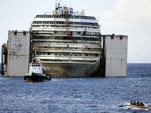 The Costa Concordia is being towed.