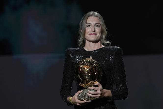 FC Barcelona player Alexia Putellas holds the trophy presented to her at the Ballon d'Or ceremony at the Théâtre du Chaâtelet, in Paris, on November 29, 2021.
