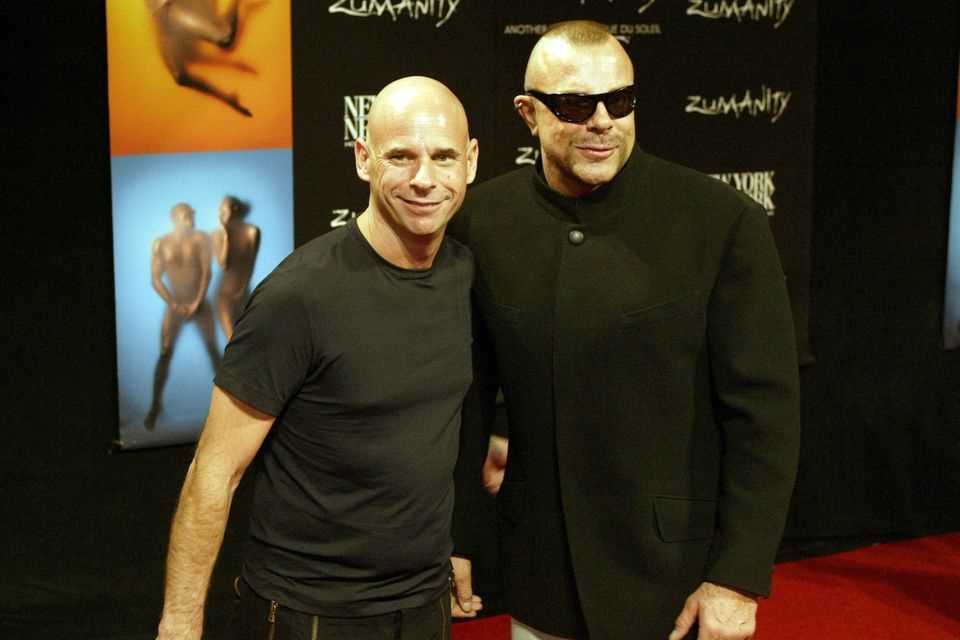 Thierry Mugler smiles alongside on the red carpet in September 2003 "Cirque du Soleil"-Founder Guy Laliberte for the photographers. 